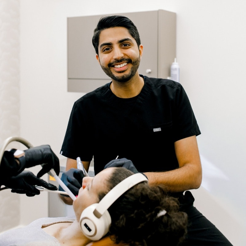 Dr. Shah smiling with patient